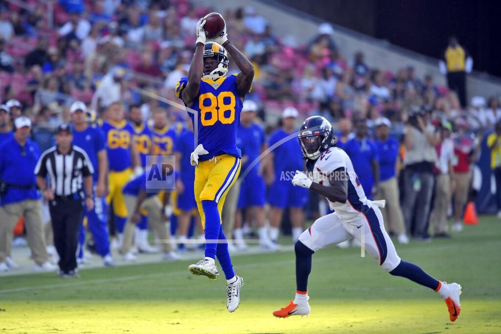 Mark J. Terrill Los Angeles Rams wide receiver Michael Thomas, left, makes a catch next to Denver Broncos defensive back Kareem Jackson during the first half of an NFL preseason football game Saturday, Aug. 24, 2019, in Los Angeles. (AP Photo/Mark J. Terrill)