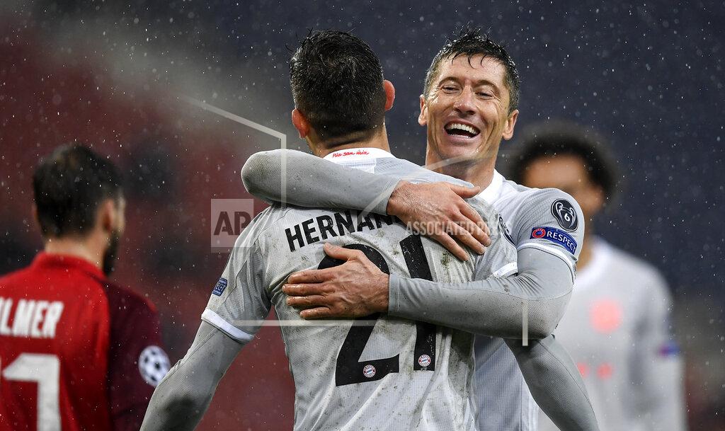Andreas Schaad Bayern's scorer Lucas Hernandez, left, celebrates with Bayern's scorer Robert Lewandowski, right, during the Champions League group A soccer match between RB Salzburg and Bayern Munich in Salzburg, Austria, Tuesday, Nov. 3, 2020. (AP Photo/Andreas Schaad)