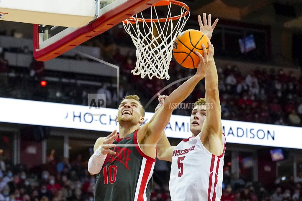 Andy Manis Ohio State's Justin Ahrens (10) shoots against Wisconsin's Tyler Wahl (5) during the first half of an NCAA college basketball game Thursday, Jan. 13, 2022, in Madison, Wis. (AP Photo/Andy Manis)