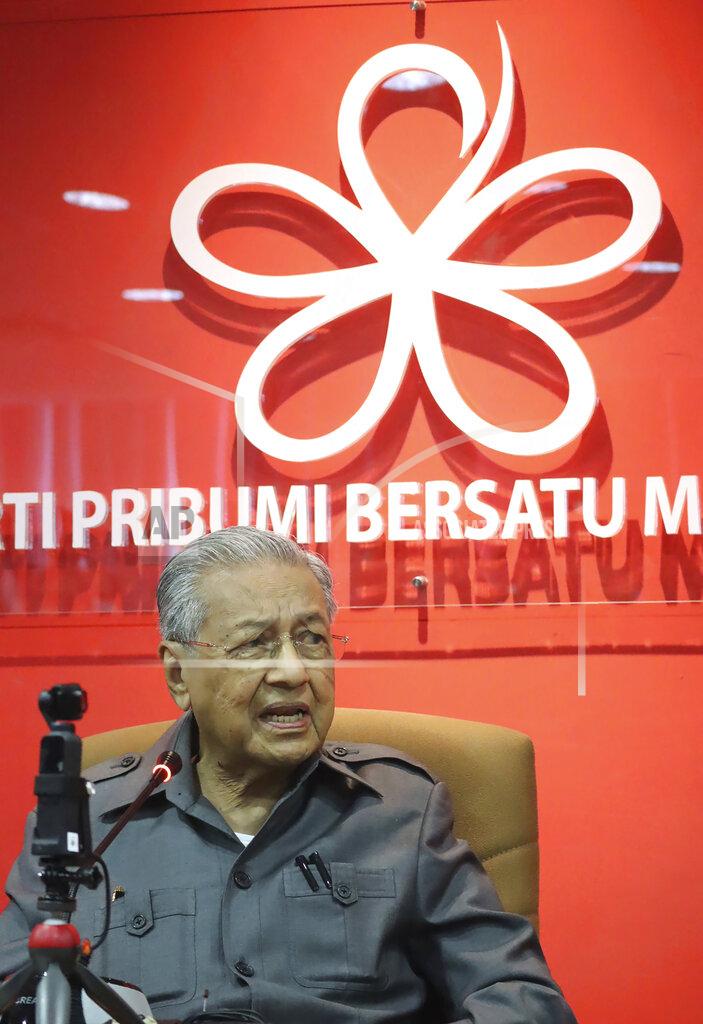 Uncredited Former Prime Minister Mahathir Mohamad speaks during a press conference at his party headquarters in Petaling Jaya, Malaysia, Friday, May 29, 2020. Mahathir has been ousted from his Malay party in the latest twist to a power struggle with his successor Muhyiddin Yassin, but he has vowed to challenge it. (AP Photo)