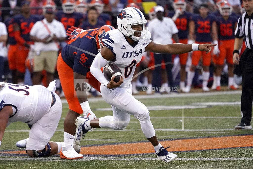 Charles Rex Arbogast UTSA quarterback Frank Harris points out an Illinois player to be blocked during the first half of an NCAA college football game against Saturday, Sept. 4, 2021, in Champaign, Ill. (AP Photo/Charles Rex Arbogast)