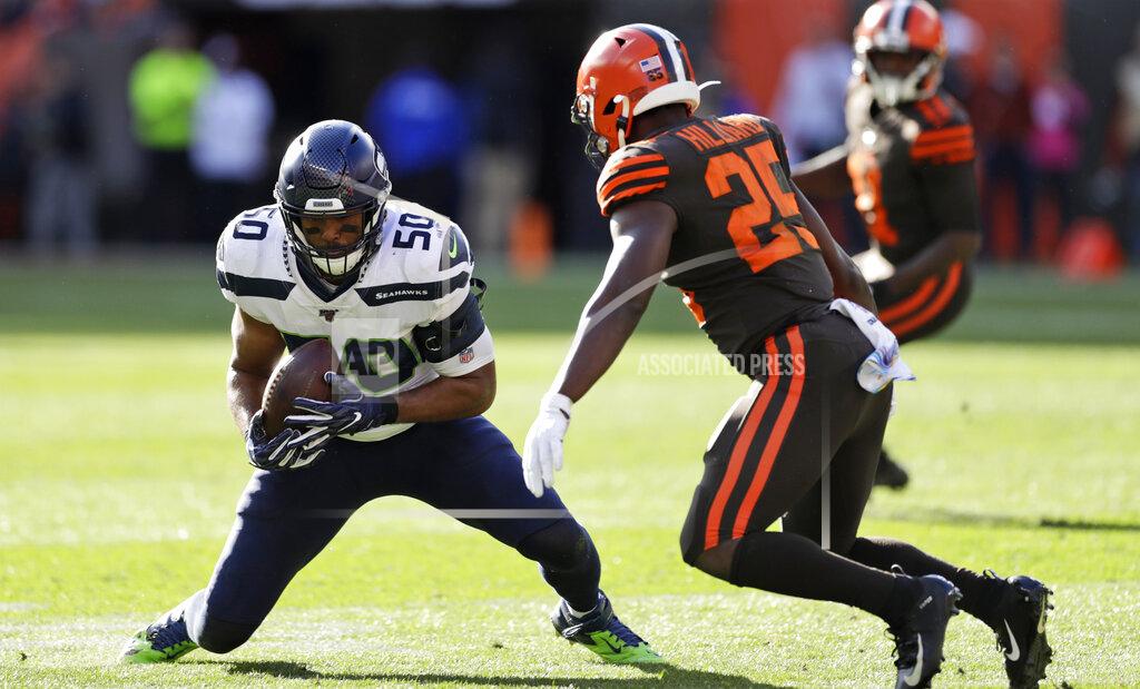 Ron Schwane Seattle Seahawks outside linebacker K.J. Wright (50) intercepts a pass during the second half of an NFL football game against the Cleveland Browns, Sunday, Oct. 13, 2019, in Cleveland. (AP Photo/Ron Schwane)