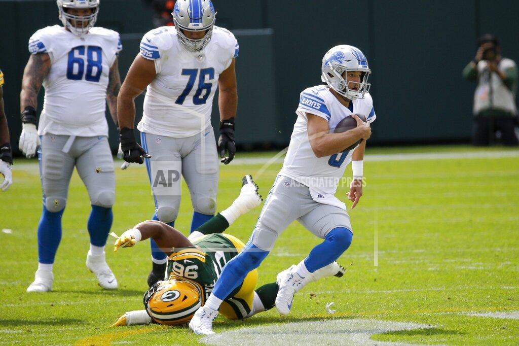 Mike Roemer Detroit Lions' Matthew Stafford runs for a first down during the first half of an NFL football game against the Green Bay Packers Sunday, Sept. 20, 2020, in Green Bay, Wis. (AP Photo/Mike Roemer)