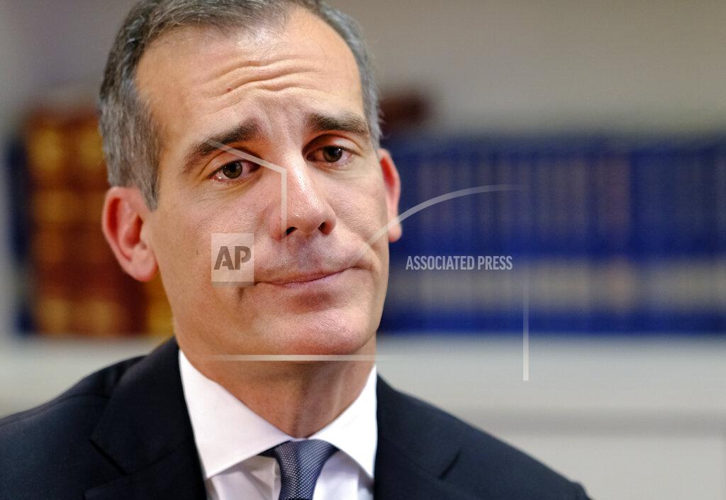 Richard Vogel FILE - In this Aug. 16, 2018 file photo, Los Angeles Mayor Eric Garcetti is interviewed by the Associated Press in Los Angeles. Garcetti has taken his name out of consideration for a possible post in the Biden administration. (AP Photo/Richard Vogel FIle)
