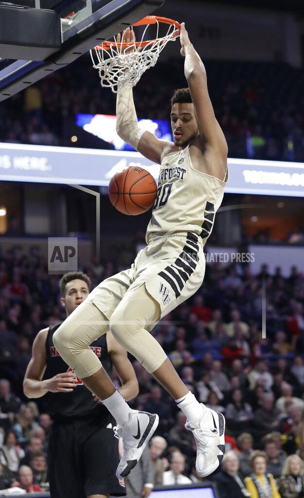 Chuck Burton Wake Forest's Olivier Sarr (30) dunks against North Carolina State during the first half of an NCAA college basketball game in Winston-Salem, N.C., Tuesday, Jan. 15, 2019. (AP Photo/Chuck Burton)