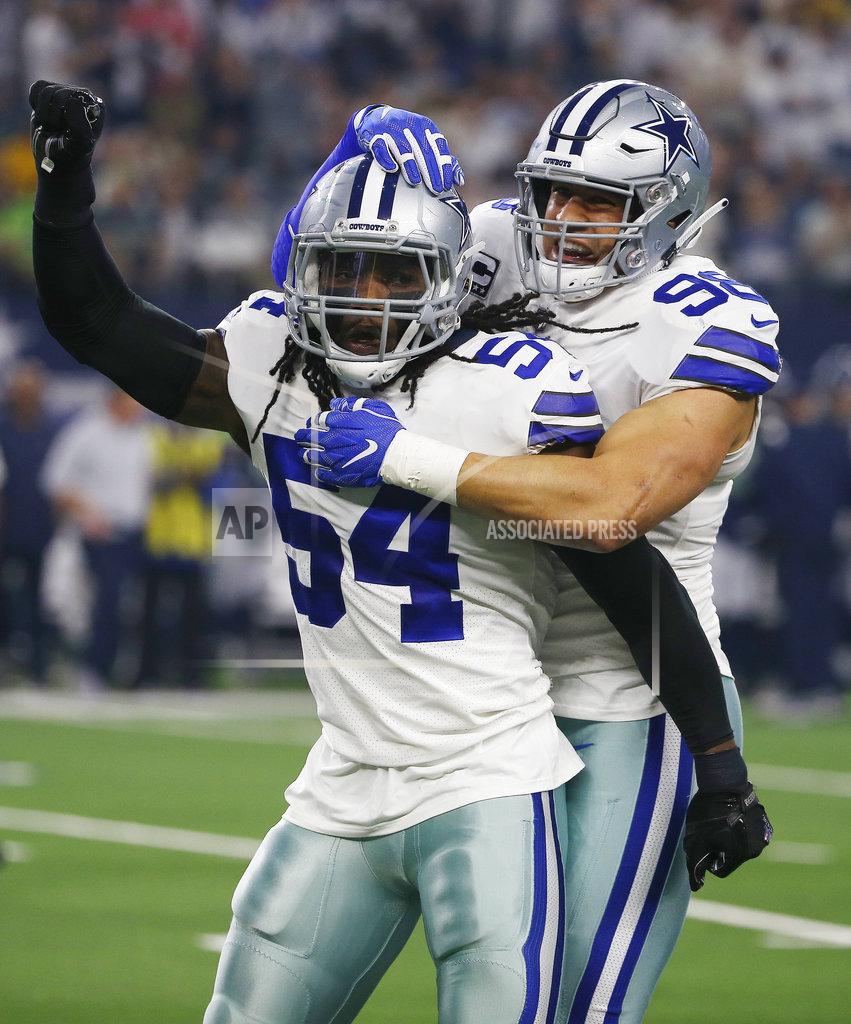 Ron Jenkins Dallas Cowboys players' Jaylon Smith (54) and Tyrone Crawford (98) celebrate a play against the Seattle Seahawks first half of the NFC wild-card NFL football game in Arlington, Texas, Saturday, Jan. 5, 2019. (AP Photo/Ron Jenkins)