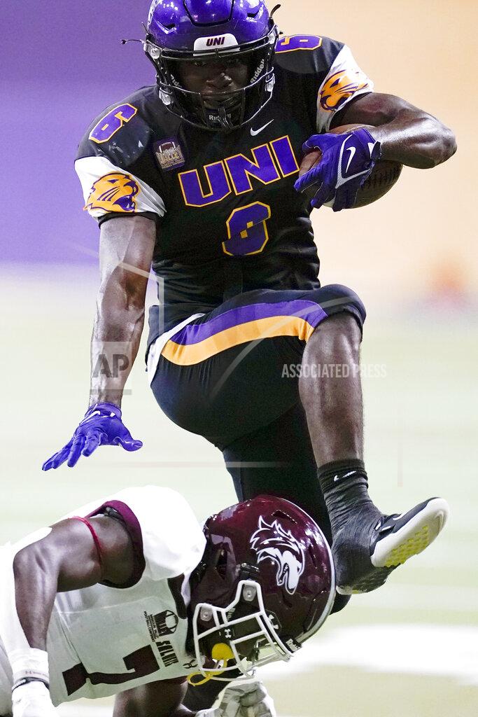 Charlie Neibergall Northern Iowa running back Bradrick Shaw, top, leaps over Southern Illinois safety Qua Brown during the second half of an NCAA college football game, Saturday, Oct. 30, 2021, in Cedar Falls, Iowa. Northern Iowa won 23-16. (AP Photo/Charlie Neibergall)