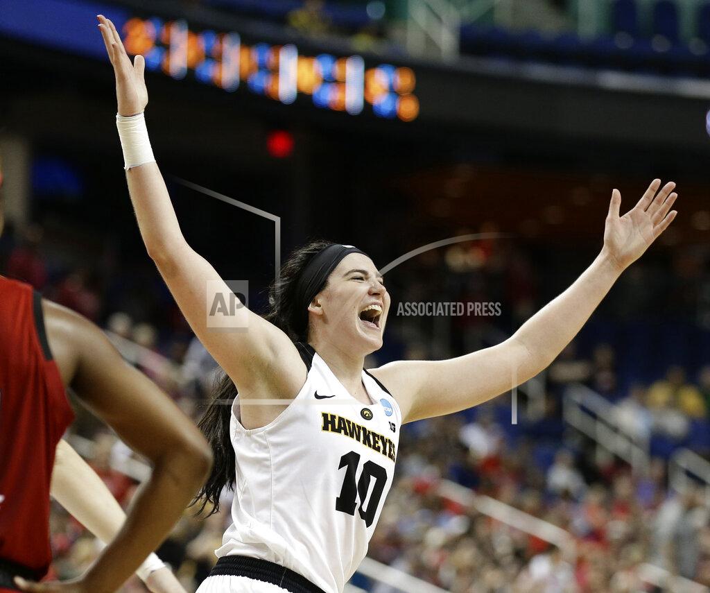 Gerry Broome FILE - In this March 30, 2019, file photo, Iowa's Megan Gustafson reacts as she leaves the court during the second half of a regional women's college basketball game against North Carolina State, in the NCAA Tournament in Greensboro, N.C. Gustafson was named The Associated Press Player of the Year, Thursday, April 4, 2019. (AP Photo/Gerry Broome, File)