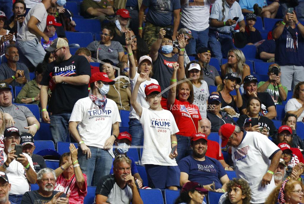 Stephen Pingry People wait for President Donald Trump to appear at the BOK Center before a rally, Saturday, June 20, 2020 in Tulsa, Okla. (Stephen Pingry/Tulsa World via AP)