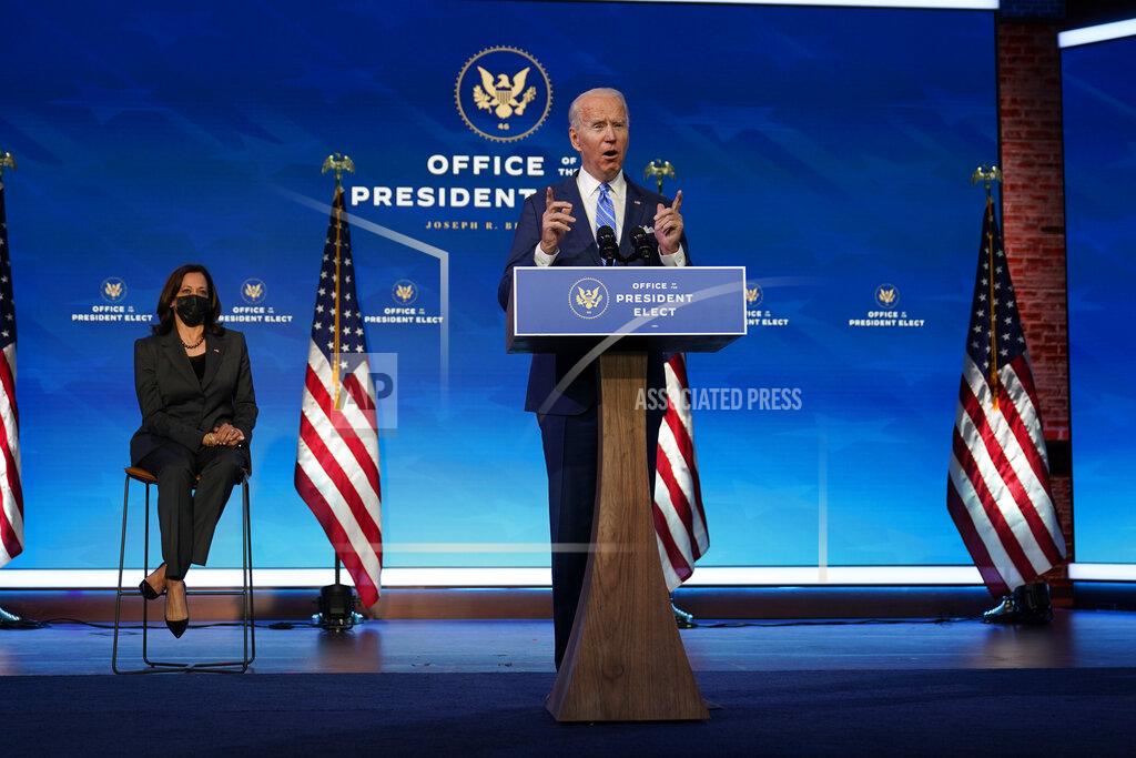 Matt Slocum President-elect Joe Biden speaks about the COVID-19 pandemic during an event at The Queen theater, Thursday, Jan. 14, 2021, in Wilmington, Del., as Vice President-elect Kamala Harris listens. (AP Photo/Matt Slocum)