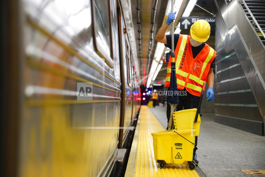 John Minchillo Contractors clean subway cars at the 96th Street station to control the spread of COVID-19, Thursday, July 2, 2020, in New York. Mass transit systems around the world have taken unprecedented — and expensive — steps to curb the spread of the coronavirus, including shutting down New York subways overnight and testing powerful ultraviolet lamps to disinfect seats, poles and floors. (AP Photo/John Minchillo)