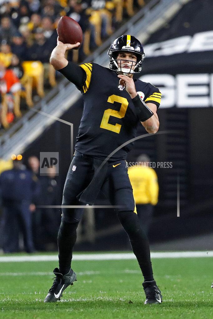 Pittsburgh Steelers quarterback Mason Rudolph throws a touchdown pass to JuJu Smith-Schuster during the second half of an NFL football game against the Miami Dolphins in Pittsburgh, Monday, Oct. 28, 2019. (AP Photo/Don Wright)