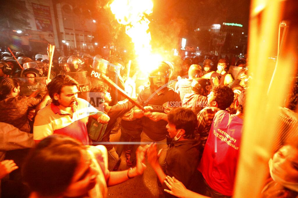 Mahmud Hossain Opu Demonstrators clash with police as they protest the death in prison of a writer who was arrested on charges of violating the sweeping digital security, in Dhaka, Bangladesh, Friday, Feb. 26, 2021. Mushtaq Ahmed, 53, was arrested in Dhaka in May last year for making comments on social media that criticized the Prime Minister Sheikh Hasina government's handling of the coronavirus pandemic. He had been denied bail at least six times. (AP Photo/Mahmud Hossain Opu)