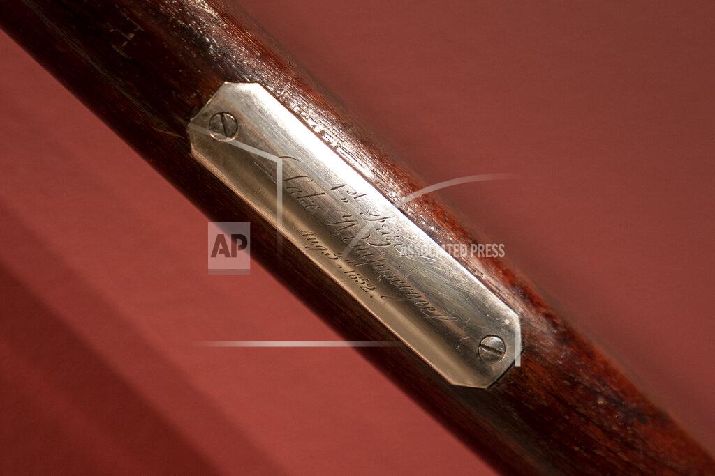 John Minchillo The Harvard-Yale Regatta 1852 Trophy Oars are displayed before an auction, Thursday, April 21, 2022, at Sotheby's in the Manhattan borough of New York. Sotheby's estimates the oars value between three and five million dollars. The oars were awarded to Harvard's winning crew and represent one of the oldest collegiate athletic competitions in the nation's history. (AP Photo/John Minchillo)