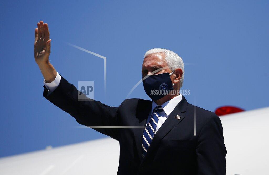 Ross D. Franklin Vice President Mike Pence waves as he arrives in Phoenix to meet with Arizona Republican Gov. Doug Ducey to discuss the surge in coronavirus cases Wednesday, July 1, 2020. (AP Photo/Ross D. Franklin)