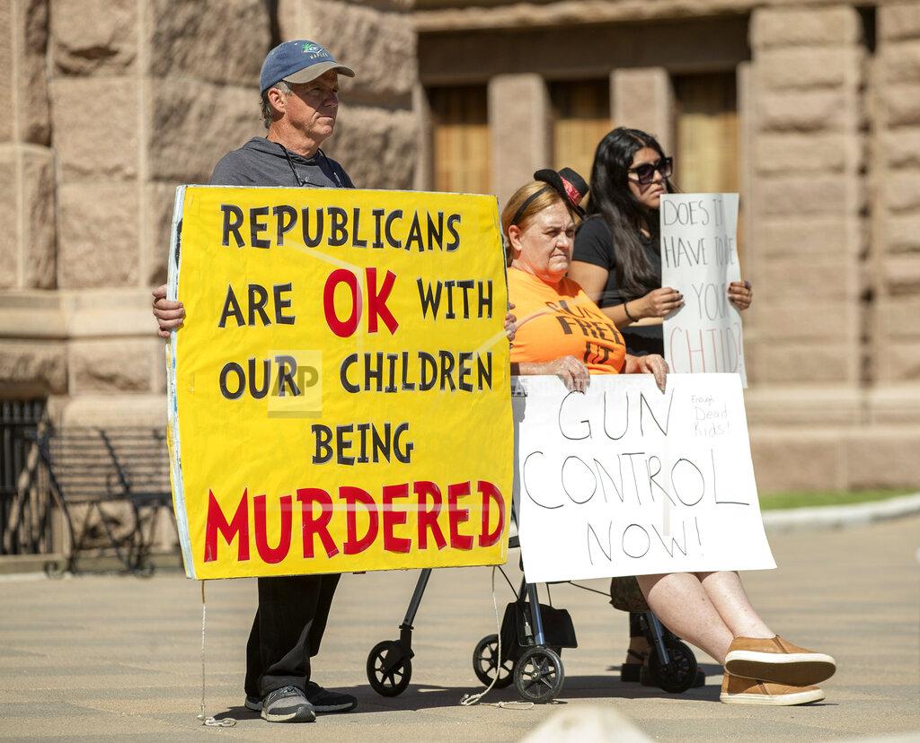 Jay Janner People hold signs during a protest at the Capitol in Austin, Texas, on Wednesday May 25, 2022, after a mass shooting at an elementary school in Uvalde. (Jay Janner/Austin American-Statesman via AP)
