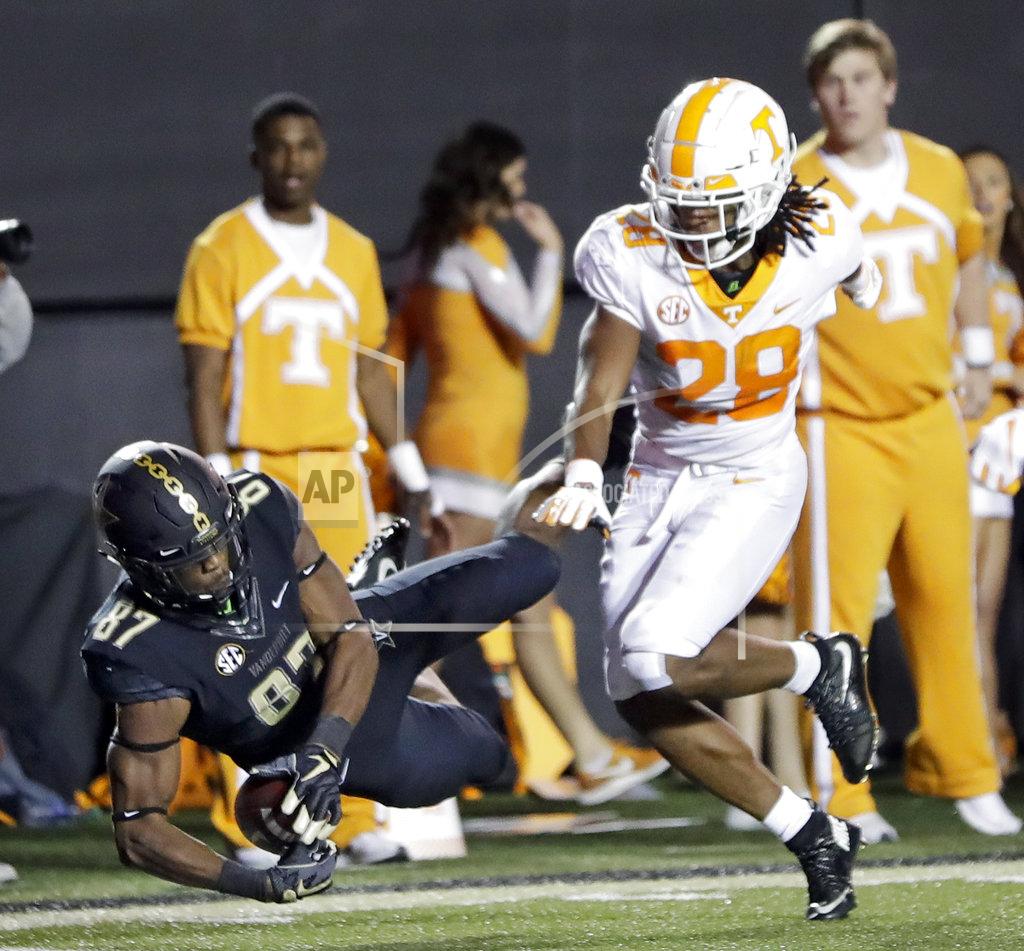 Mark Humphrey Vanderbilt wide receiver Amir Abdur-Rahman (87) catches a 26-yard touchdown pass as he is defended by Tennessee defensive back Baylen Buchanan (28) in the second half of an NCAA college football game Saturday, Nov. 24, 2018, in Nashville, Tenn. (AP Photo/Mark Humphrey)