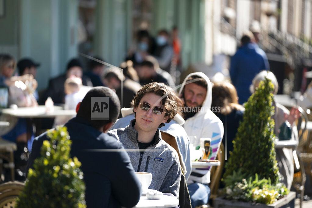 Jon Super Customers sit outside a restaurant in Liverpool, Monday, April 12, 2021, as restaurants, bars and pubs can open and serve people who can be seated outside. Millions of people in England will get their first chance in months for haircuts, casual shopping and restaurant meals on Monday, as the government takes the next step on its coronavirus lockdown-lifting road map. (AP Photo Jon Super)