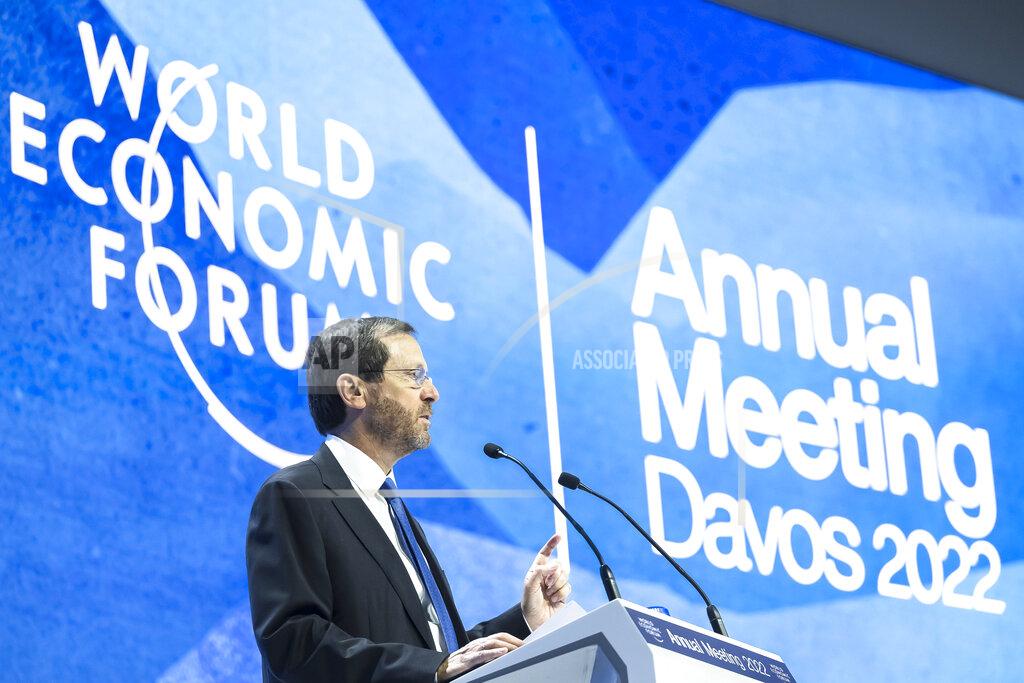 Gian Ehrenzeller Isaac Herzog, President of the State of Israel, left, delivers a speech at the 51st annual meeting of the World Economic Forum, WEF, in Davos, Switzerland, on Wednesday, May 25, 2022. The forum has been postponed due to the Covid-19 outbreak and was rescheduled to early summer. The meeting brings together entrepreneurs, scientists, corporate and political leaders in Davos under the topic "History at a Turning Point: Government Policies and Business Strategies" from 22 - 26 May 2022. (Gian Ehrenzeller/Keystone via AP)