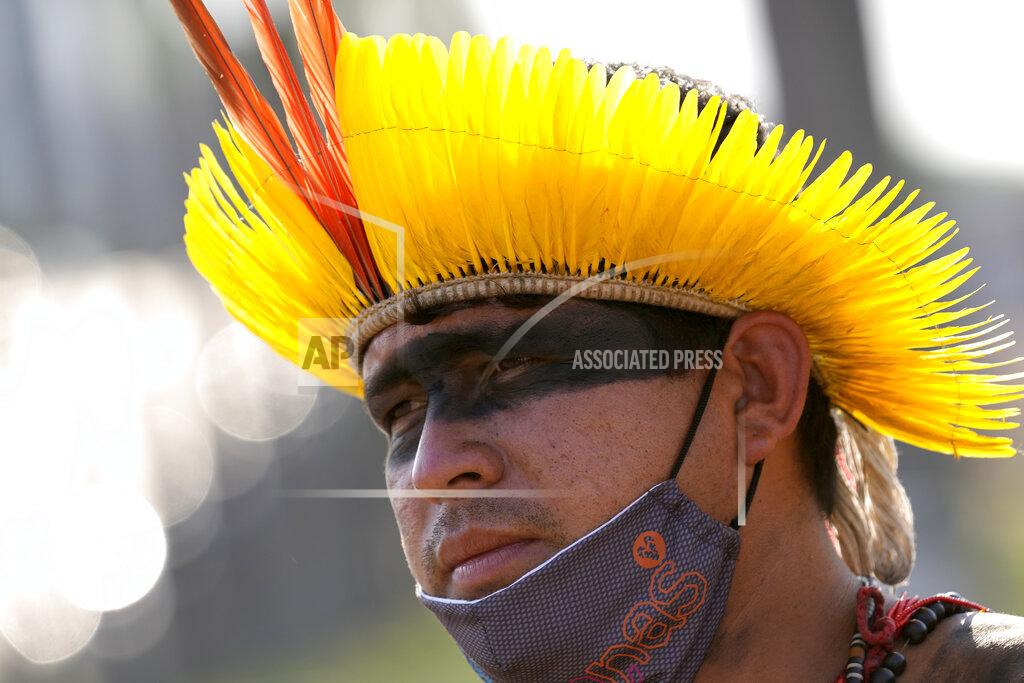 Eraldo Peres An Indigenous man reacts after the Supreme Court judges' decision to suspend the vote that defines the demarcation of Indigenous lands, during a protest in front of the Supreme Court building, in Brasilia, Brazil, Wednesday, Sept. 15, 2021. (AP Photo/Eraldo Peres)
