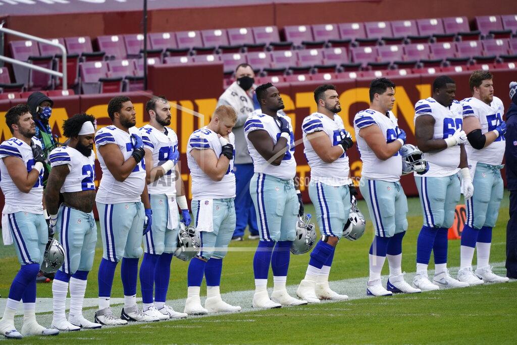 Susan Walsh Members of the Dallas Cowboys on the sidelines during the national anthem before the start of the first half of an NFL football game against Washington Football Team, Sunday, Oct. 25, 2020, in Landover, Md. (AP Photo/Susan Walsh)