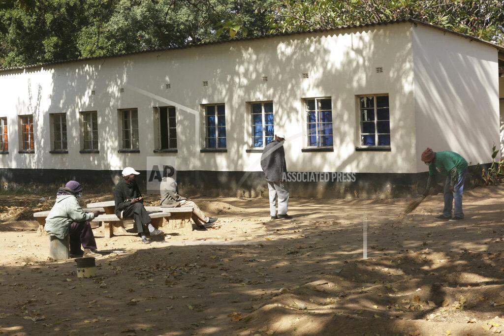 Tsvangirayi Mukwazhi A man sweeps the premises at the Society for the Destitute Aged care home in Harare's Highfield township, Zimbabwe, Thursday June 24, 2021. The economic ravages of COVID-19 are forcing some families in Zimbabwe to abandon the age old tradition of taking care of the elderly. Zimbabwe's care homes have experienced a 60% increase in admissions since the outbreak of the pandemic in March last year. (AP Photo/Tsvangirayi Mukwazhi)