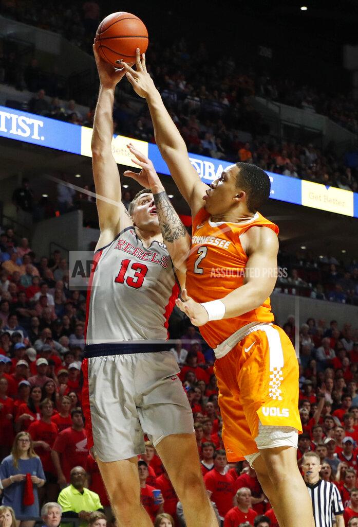 Rogelio V. Solis Tennessee forward Grant Williams (2) blocks a shot attempt by Mississippi center Dominik Olejniczak (13) during the second half of an NCAA college basketball game in Oxford, Miss., Wednesday, Feb. 27, 2019. Tennessee won 73-71. (AP Photo/Rogelio V. Solis)