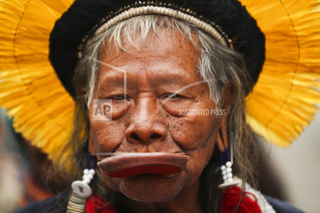 FILE - In this May 17, 2019 file photo, Brazil's rainforest activist Chief Raoni Metuktire attends a march for climate in Brussels. The 90-year-old leader who has become a symbol of the fight for Indigenous rights and preservation of the Amazon rainforest has been hospitalized, his institute and a relative confirmed Saturday, July 18, 2020. (AP Photo/Francisco Seco, File)