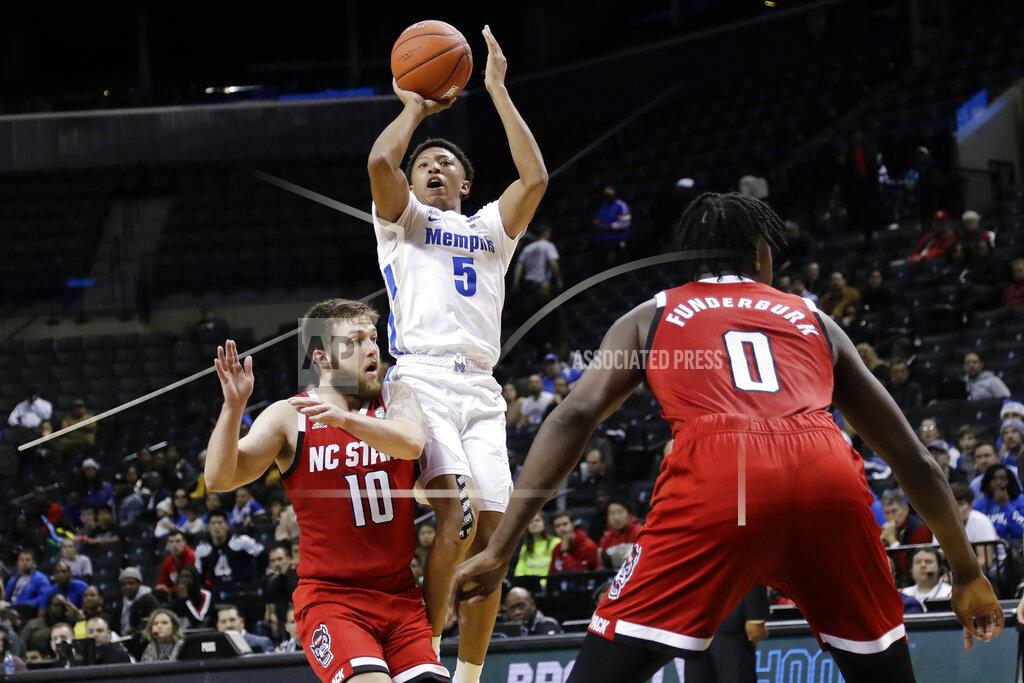Frank Franklin Ii Memphis' Boogie Ellis (5) shoots over North Carolina State's Braxton Beverly (10) and DJ Funderburk (0) during the first half of an NCAA college basketball game in the Barclays Classic, Thursday, Nov. 28, 2019, in New York. (AP Photo/Frank Franklin II)