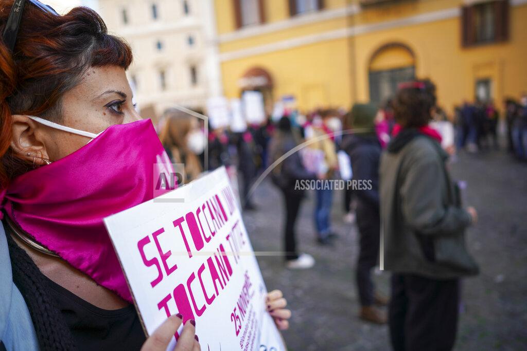 Andrew Medichini Women take part in a demonstration on the International Day for the Elimination of Violence against Women, in Rome, Wednesday, Nov. 25, 2020. (AP Photo/Andrew Medichini)