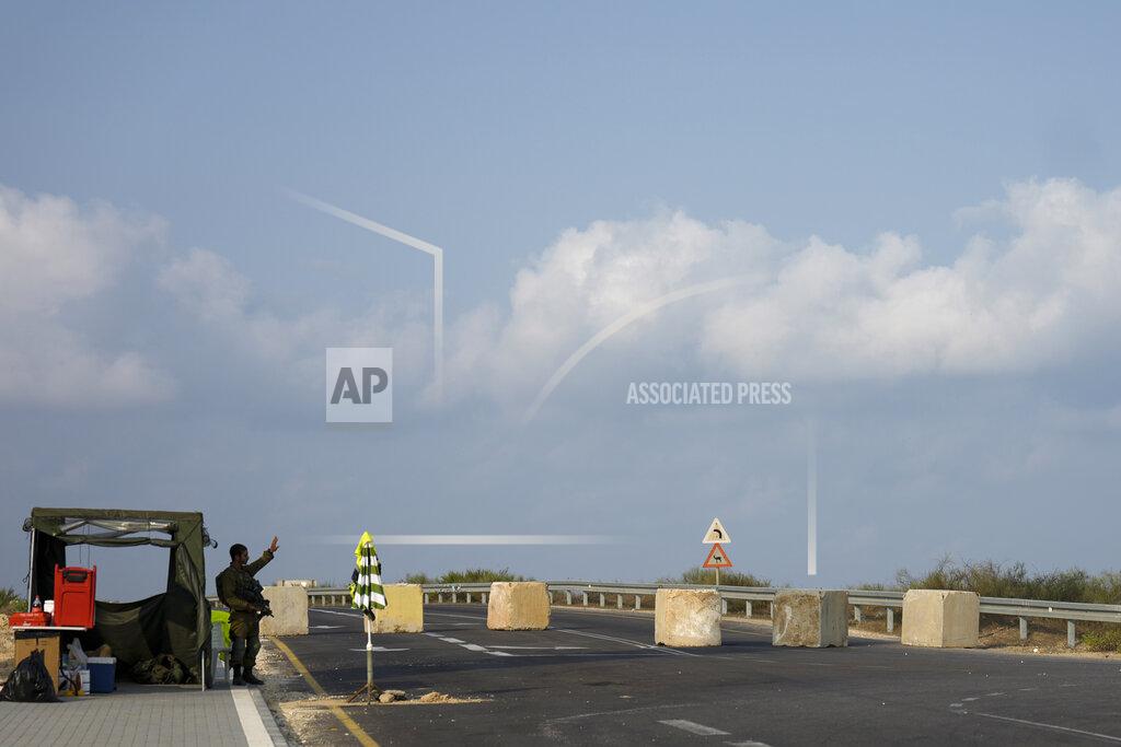 Ariel Schalit An Israeli soldier secures a road block leading to the border with Gaza Strip, Friday, Aug. 5, 2022. The Israeli military says it is sending additional forces to the area around the Gaza Strip as it braces for possible attacks after the arrest of a senior militant in the West Bank this week. Authorities closed roads and other areas around Gaza after a raid Monday night. (AP Photo/Ariel Schalit)