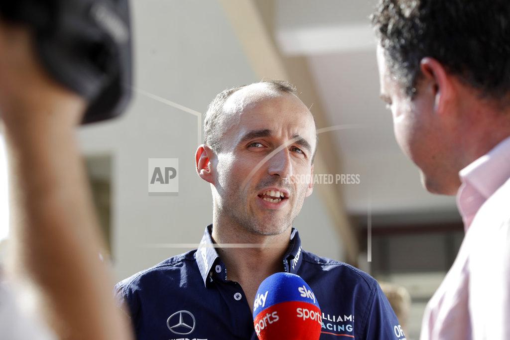 Luca Bruno Driver Robert Kubica answers to reporters at the Yas Marina racetrack in Abu Dhabi, United Arab Emirates, Thursday, Nov. 22, 2018. The Emirates Formula One Grand Prix will take place on Sunday. Robert Kubica will make his return to Formula One next year with the Williams team.(AP Photo/Luca Bruno)
