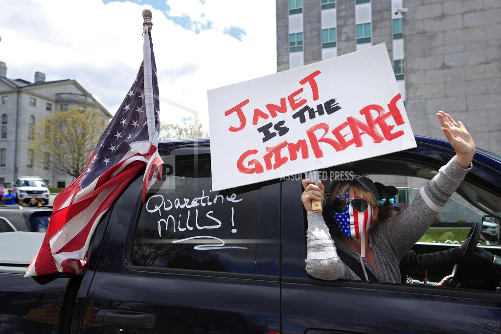 Robert F. Bukaty Protesters rally against the executive orders by Maine Gov. Janet Mills to keep some of Maine businesses closed to help prevent the spread of coronavirus, Saturday, May 16, 2020, in Augusta, Maine. (AP Photo/Robert F. Bukaty)