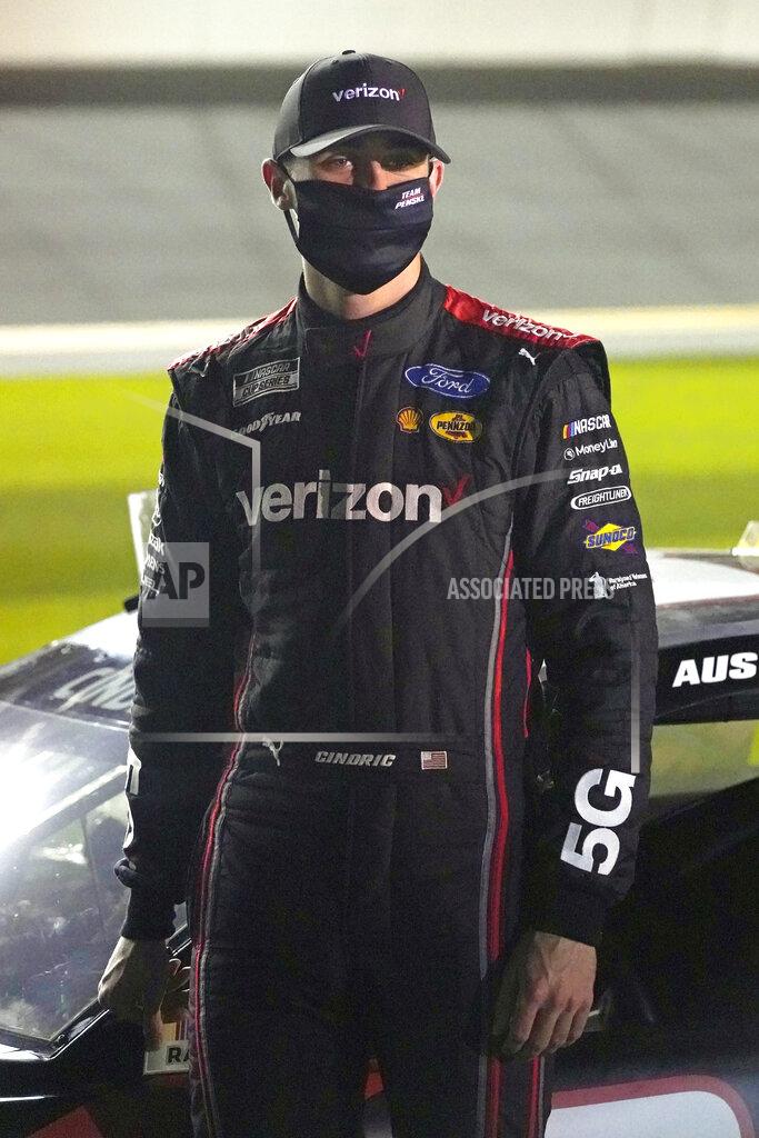 John Raoux FILE- In this Wednesday, Feb. 10, 2021, file photo, Austin Cindric stands on pit road during qualifying for the NASCAR Daytona 500 auto race at Daytona International Speedway in Daytona Beach, Fla. Cindric solidified his standing at Penske by winning six races last year and his first Xfinity Series championship. (AP Photo/John Raoux, File)