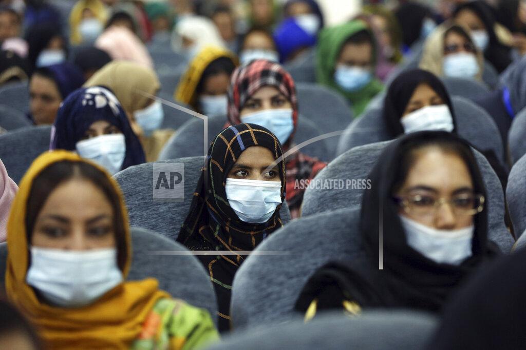 Rahmat Gul Delegates wearing a protective face masks to help curb the spread of the coronavirus attend an Afghan Loya Jirga meeting in Kabul, Afghanistan, Friday, Aug. 7, 2020. The traditional council opened Friday in the Afghan capital to decide the release of a final 400 Taliban - the last hurdle to the start of negotiations between Kabul’s political leadership and the Taliban in keeping with a peace deal the United States signed with the insurgent movement in February. (AP Photo/Rahmat Gul)