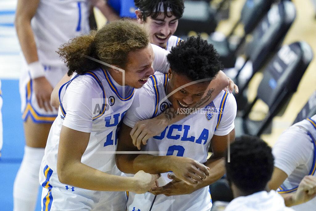Ashley Landis UCLA forward Mac Etienne, left, celebrates with guard Jaylen Clark (0) after Clark made a free throw to give UCLA the lead in the final seconds of an NCAA college basketball game against Arizona State on Saturday, Feb. 20, 2021, in Los Angeles. UCLA won 80-79. (AP Photo/Ashley Landis)