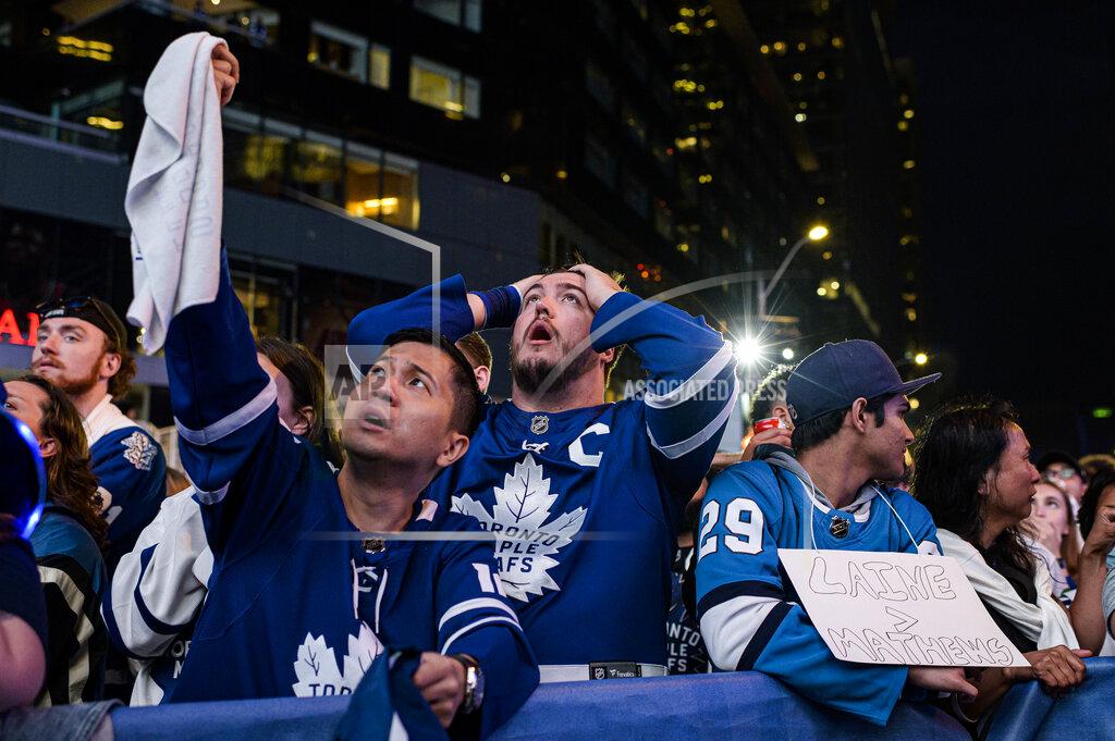 Christopher Katsarov Fans react during Game 7 of an NHL hockey first-round playoff series between the Toronto Maple Leafs and the Tampa Bay Lightning in Toronto, Saturday May 14, 2022. (Christopher Katsarov/The Canadian Press via AP)