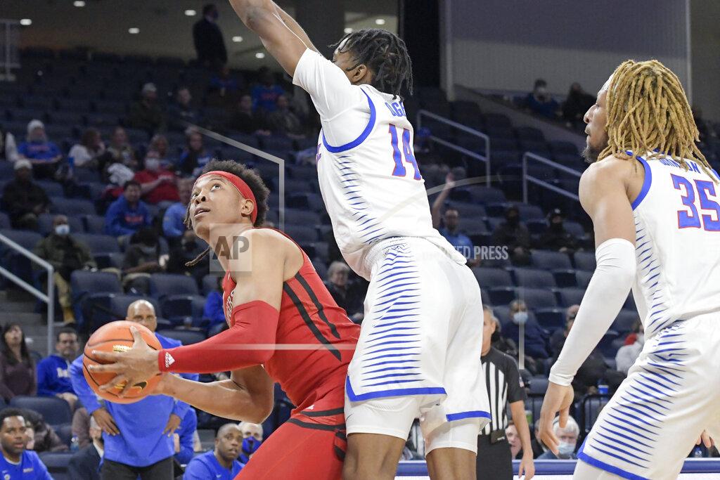 Mark Black Rutgers' Ralph Gonzales-Agee, left, maneuvers for a shot against DePaul's Nick Ongenda (14) during the first half of an NCAA college basketball game Thursday, Nov. 18, 2021, in Chicago. (AP Photo/Mark Black)
