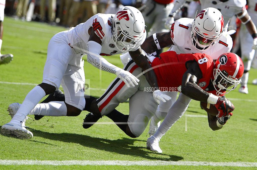 Mike Stewart Georgia running back James Cook (6) scores a touchdown against Austin Peay defensive back Malik Davis (1) during the first half of an NCAA college football game, Saturday, Sept. 1, 2018, in Athens, Ga. (AP Photo/Mike Stewart)