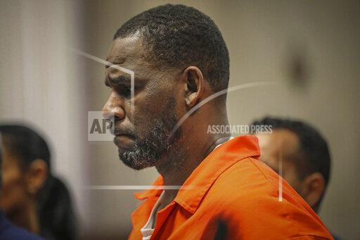 FILE - In this Sept. 17, 2019, file photo, R. Kelly appears during a hearing at the Leighton Criminal Courthouse in Chicago. A federal judge on Wednesday, Oct. 20, 2021, ordered R&B superstar R. Kelly to stand trial in Chicago on child pornography and obstruction of justice charges next year after the scheduled sentencing for his conviction in an earlier sex trafficking trial in New York. (Antonio Perez/Chicago Tribune via AP, Pool, File)