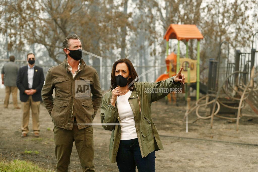 Gary Kazanjian FILE - In this Sept. 15, 2020, file photo, California Gov. Gavin Newsom, left, and then Democratic vice presidential candidate Sen. Kamala Harris, D-Calif., talk as they asses the damage during the Creek Fire at Pine Ridge Elementary in Auberry, Calif. Harris will address California Democratic Party activists on Saturday, May 1, 2021, her first time speaking at the party's annual convention as the second highest office holder in the country. (AP Photo/Gary Kazanjian, File)
