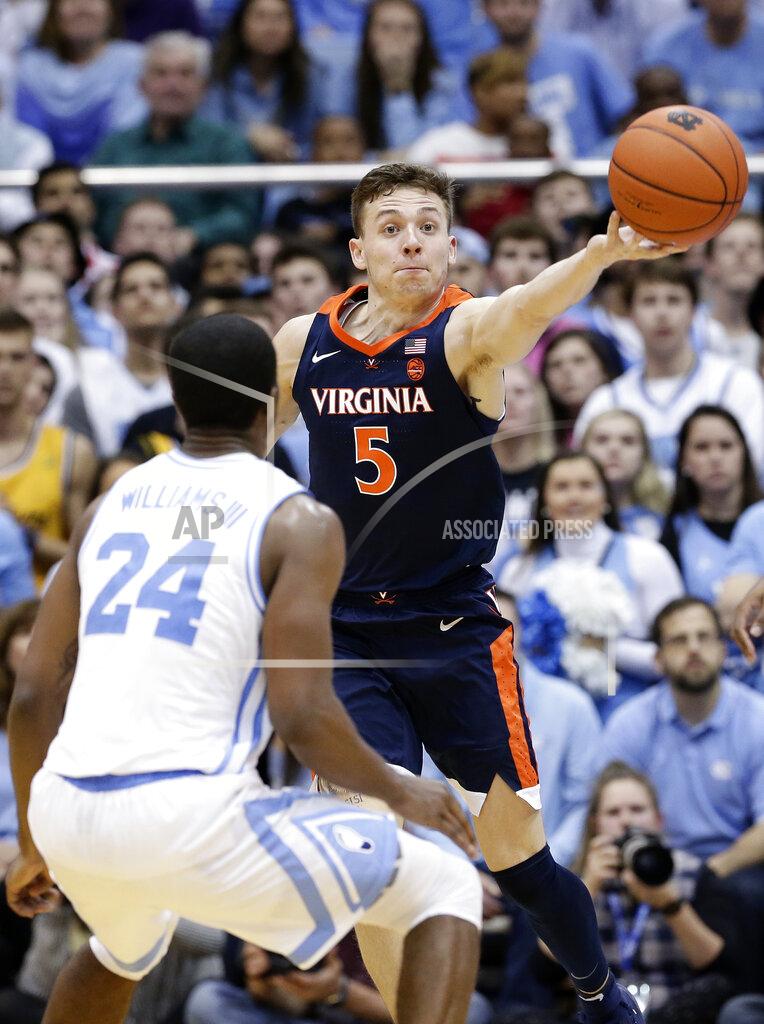Gerry Broome North Carolina's Kenny Williams (24) guards Virginia's Kyle Guy (5) during the second half of an NCAA college basketball game in Chapel Hill, N.C., Monday, Feb. 11, 2019. Virginia won 69-61. (AP Photo/Gerry Broome)