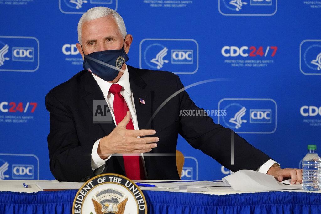John Bazemore Vice President Mike Pence speaks during a briefing on COVID-19 at the Centers for Disease Control and Prevention Friday, Dec. 4, 2020, in Atlanta. (AP Photo/John Bazemore)