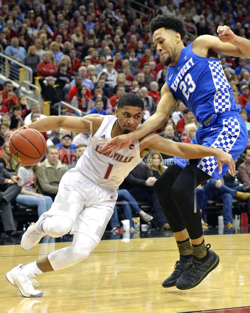 Timothy D. Easley Kentucky forward EJ Montgomery (23) attempts to stop Louisville guard Christen Cunningham (1) from driving past him during the second half of an NCAA college basketball game in Louisville, Ky., Saturday, Dec. 29, 2018. Kentucky won 71-58. (AP Photo/Timothy D. Easley)