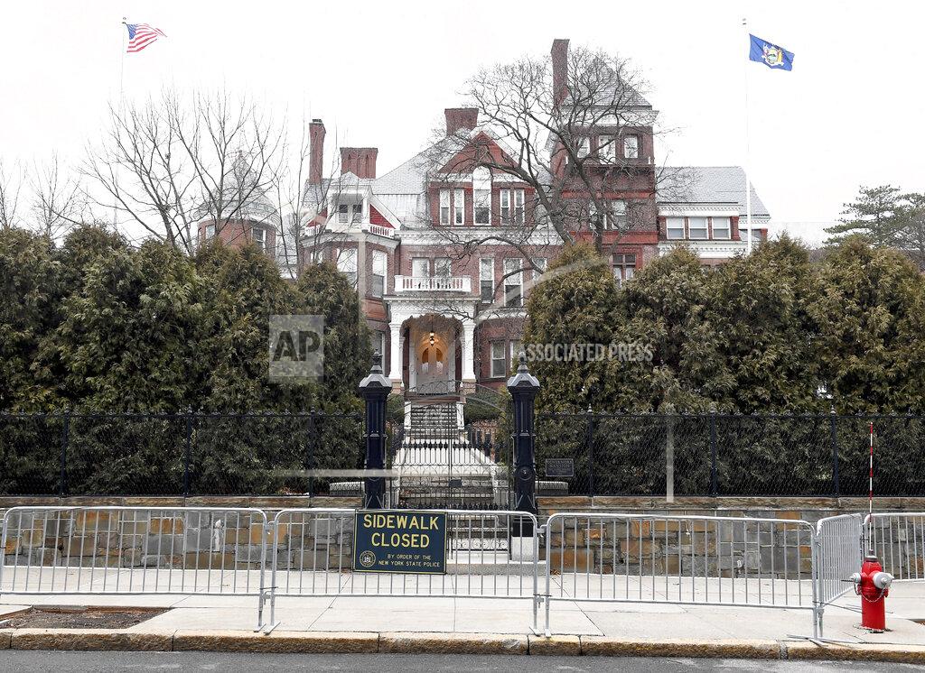 FILE - This Sunday Jan. 17, 2021, file photo shows the New York state Executive Mansion surrounded with security fencing in Albany, N.Y. A sixth woman has come forward alleging that Gov. Andrew Cuomo inappropriately touched her late last year, during an encounter at the mansion. (AP Photo/Hans Pennink, File)