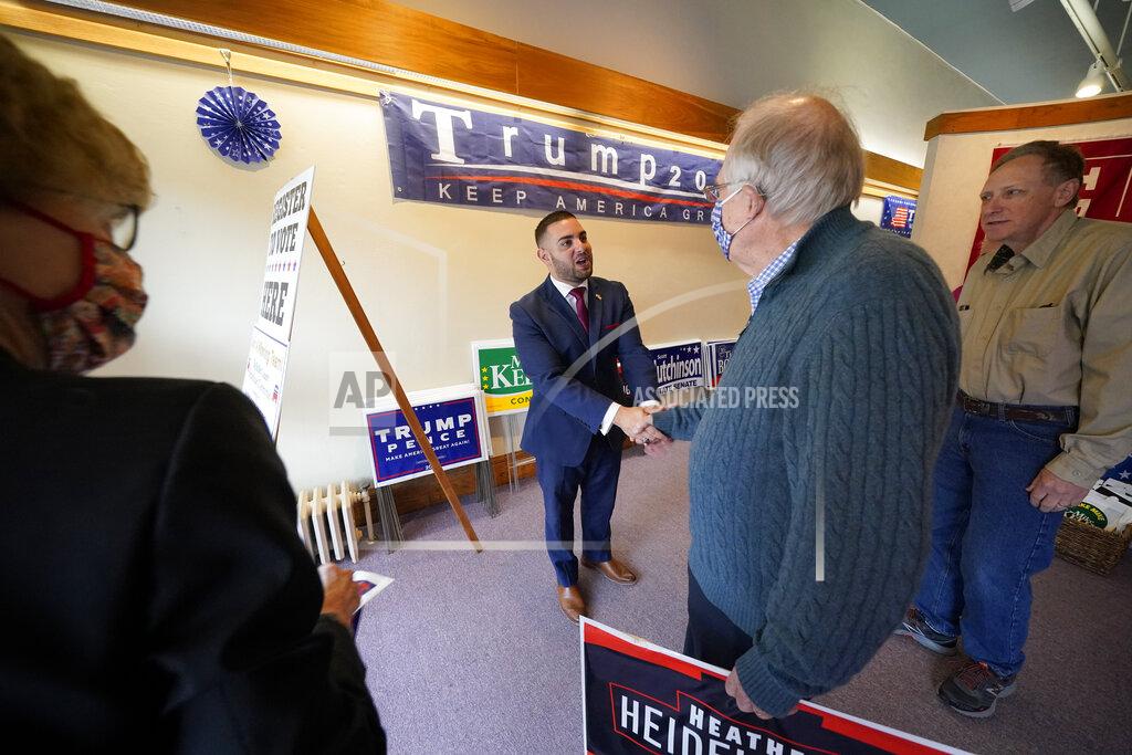 Gene J. Puskar FILE - In this Thursday, Oct. 15, 2020 file photo, Slippery Rock, Pa., Republican Mayor Jondavid Longo, center, greets Donald Trump supporters Dale Filstrup, left, and her husband, Al, second right, of Pittsburgh, at the Butler County Republican Committee office in Slippery Rock, Pa. Trump won Butler County handily in November, evidence of his campaign to supercharge turnout in rural, conservative places as he cedes ground in the cities and suburbs. (AP Photo/Gene J. Puskar)