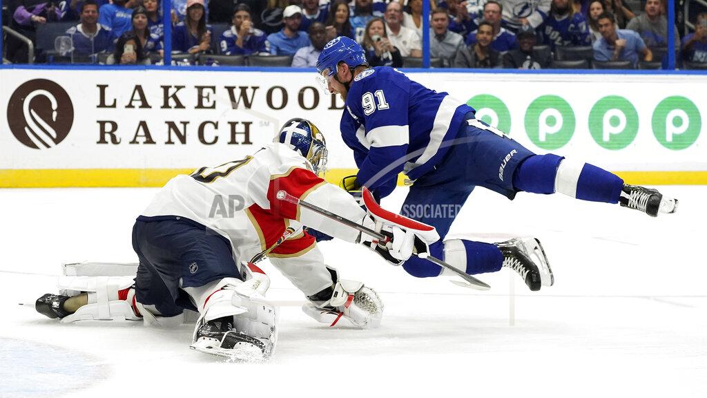 Chris O'MEara Tampa Bay Lightning center Steven Stamkos (91) flies through the air after trying to get around Florida Panthers goaltender Spencer Knight (30) during the second period of an NHL hockey game Tuesday, Oct. 19, 2021, in Tampa, Fla. (AP Photo/Chris O'Meara)