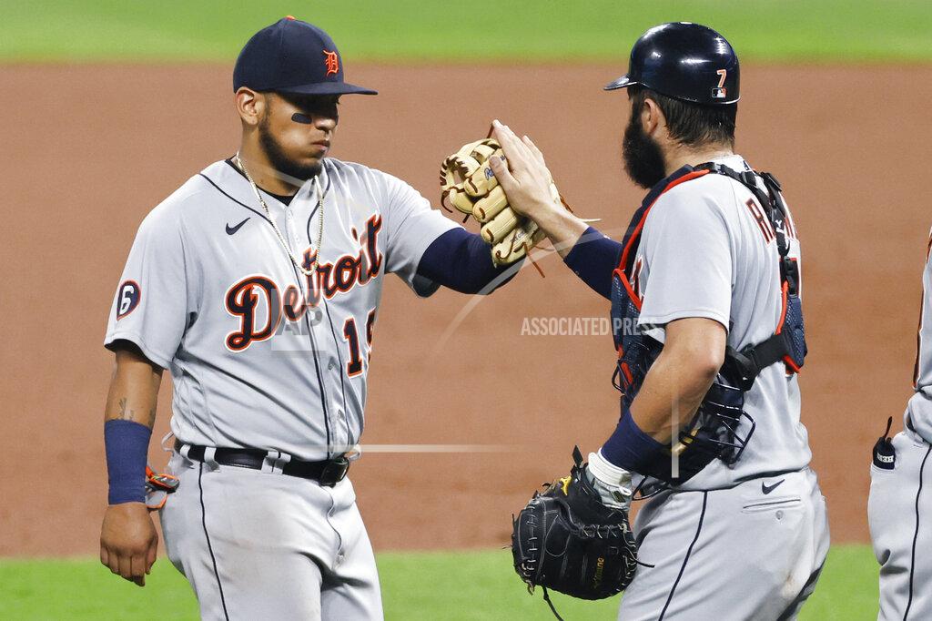 Ron Schwane Detroit Tigers' Isaac Paredes, left, and Austin Romine celebrate a victory over the Cleveland Indians in a baseball game, Friday, Aug. 21, 2020, in Cleveland. (AP Photo/Ron Schwane)