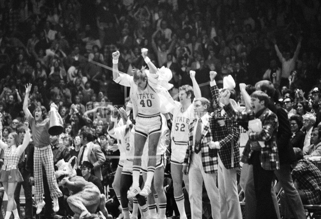Anonymous FILE - In this March 23, 1974, file photo, North Carolina State's Mark Noeller (40) jumps into the air as they defeat UCLA 80-77 in double overtime in a semifinal game at the NCAA college basketball championships in Greensboro, N.C. (AP Photo/File)
