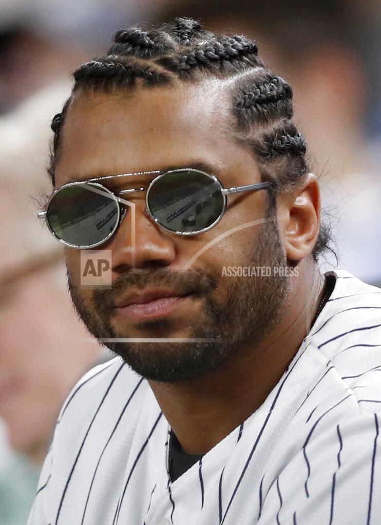 Kathy Willens Seattle Seahawks quarterback Russell Simmons wears pinstripes as he watches a baseball game between the New York Yankees and the Houston Astros, Friday, June 21, 2019, in New York. (AP Photo/Kathy Willens)